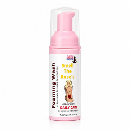 A bottle of Lakay Remedies 'Smell The Rose's pH balanced daily care foaming wash. The product features a pink pump dispenser and a white label with pink and yellow text, set against a plain white background.