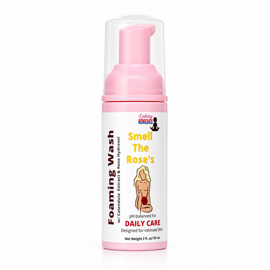 A bottle of Lakay Remedies 'Smell The Rose's pH balanced daily care foaming wash. The product features a pink pump dispenser and a white label with pink and yellow text, set against a plain white background.