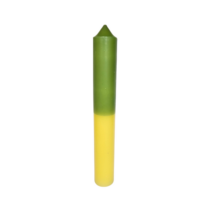 Two-tone green and yellow candle on a white background